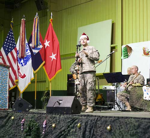 Sgt. First Class Jodie Manford and the 3rd Infantry Division Band on stage